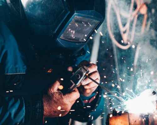 man using welding machine